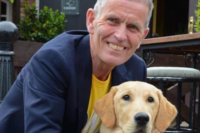 Carl Mowatt and guide dog in training Andy