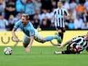 Kevin De Bruyne of Manchester City is fouled by Kieran Trippier of Newcastle United, leading to a red card which is later overturned by VAR during the Premier League match between Newcastle United and Manchester City at St. James Park on August 21, 2022 in Newcastle upon Tyne, England. (Photo by Clive Brunskill/Getty Images)
