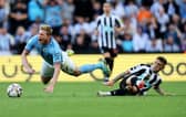 Kevin De Bruyne of Manchester City is fouled by Kieran Trippier of Newcastle United, leading to a red card which is later overturned by VAR during the Premier League match between Newcastle United and Manchester City at St. James Park on August 21, 2022 in Newcastle upon Tyne, England. (Photo by Clive Brunskill/Getty Images)