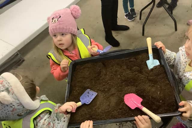 Green-fingered youngsters from Nurserytime got to work at Hebburn Cemetery's new greenhouses.