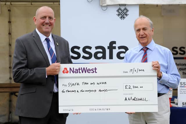 SSAFA's Jeremy Feggetter, right, receives a cheque from Andrew Marshall. Picture by Tim Richardson.