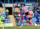 Tom Flanagan nets the winner against Gillingham.