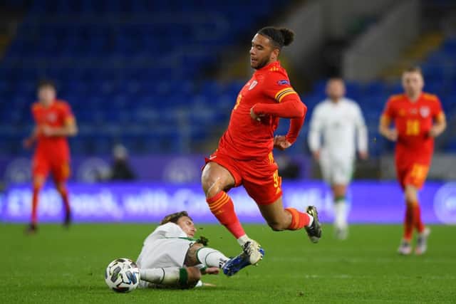 Jeff Hendrick brings down Wales' Tyler Roberts.