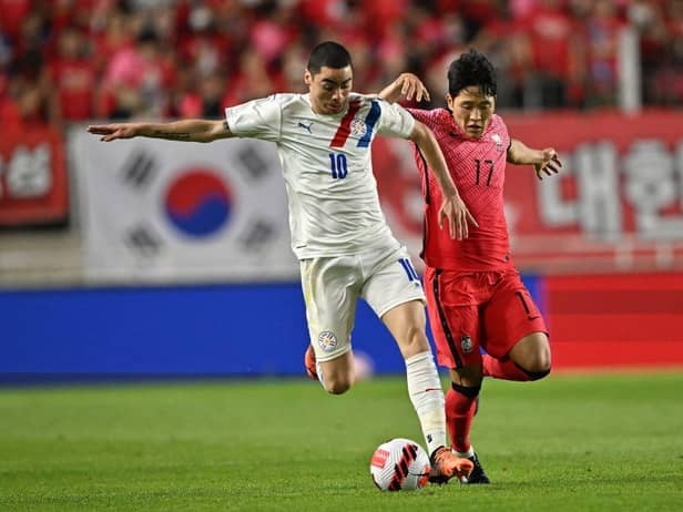 Paraguay's Miguel Almiron (L) fights for the ball with South Korea's Na Sang-ho (R) during a friendly football match between South Korea and Paraguay in Suwon on June 10, 2022. (Photo by Jung Yeon-je / AFP) (Photo by JUNG YEON-JE/AFP via Getty Images)