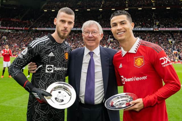 Former Manager Sir Alex Ferguson congratulates Cristiano Ronaldo and David de Gea of Manchester United on their achievements ahead of the Premier League match between Manchester United and Newcastle United at Old Trafford on October 16, 2022 in Manchester, England. (Photo by Ash Donelon/Manchester United via Getty Images)