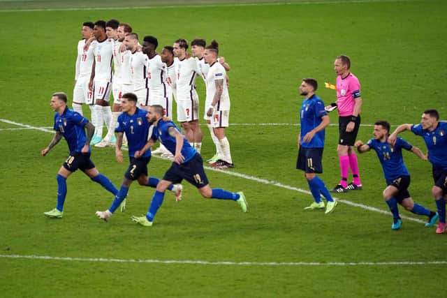England players look on during the penalty shoot out