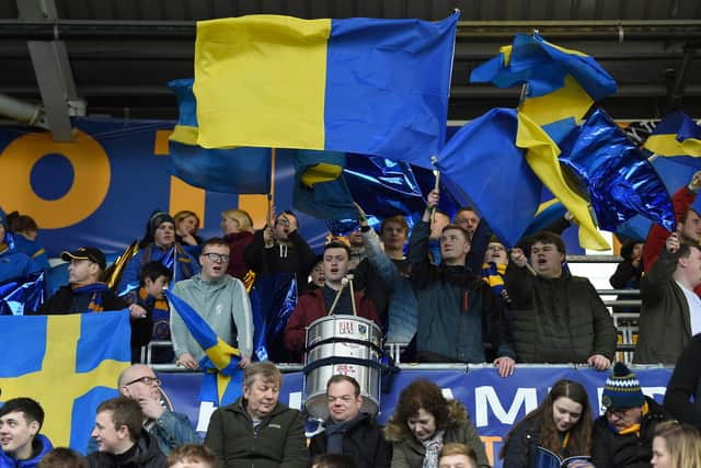 Fans stand in the safe standing section at the Montgomery Waters Meadow stadium ahead of the English FA Cup fourth round football match between Shrewsbury Town and Wolverhampton Wanderers in Shrewsbury, central England, on January 26, 2019. (Photo by PAUL ELLIS/AFP via Getty Images)