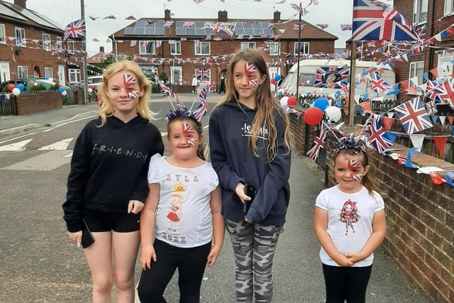 The girls show off their fantastic Union Flag face paint designs.
