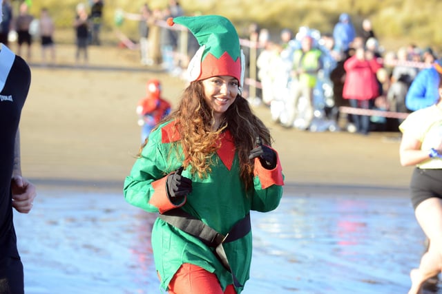 Little Mix star Jade Thirlwall dressed an elf as she supports Cancer Connections with the Boxing Day Dip