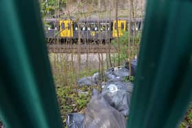 Rubbish that was recently dumped over railings on the Metro line embankment near Chichester station.