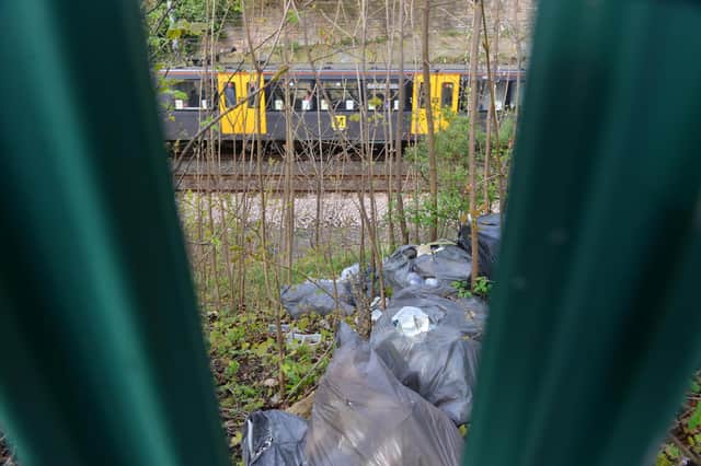 Rubbish that was recently dumped over railings on the Metro line embankment near Chichester station.