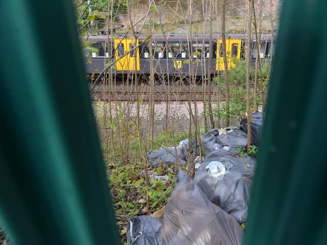 Rubbish that was recently dumped over railings on the Metro line embankment near Chichester station.