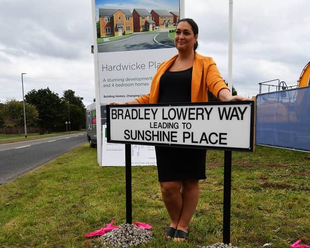 Gemma Lowery, pictured behind the Bradley Lowery Way sign, when the street was pictured in September 2021.