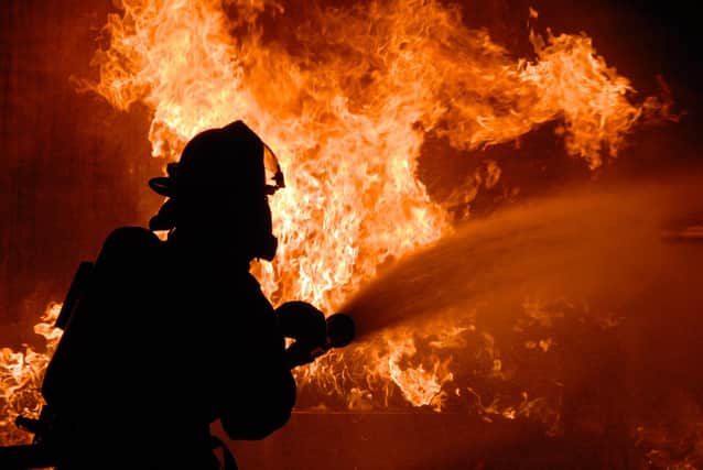 Stock picture from Pixabay of a firefighter in action