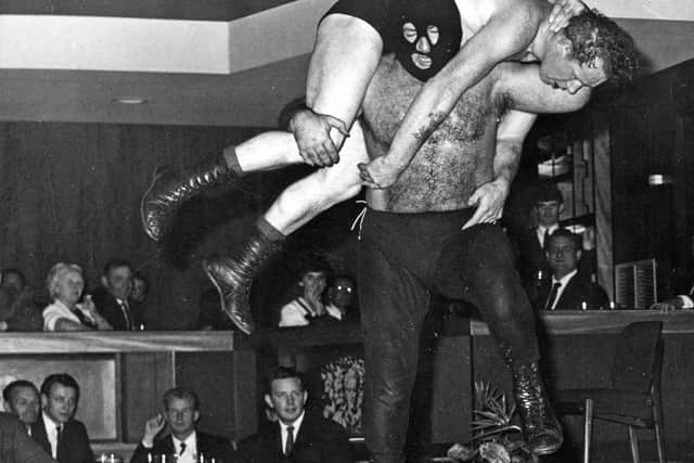 Masked heavyweight wrestler, Dr No met Scotland's Rob Roy, at the Club Latino in 1966.