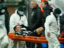 Fabian Schar of Newcastle United goes off injured on a stretcher during the Premier League match between Newcastle United and Southampton at St. James Park on February 06, 2021  (Photo by Owen Humphreys - Pool/Getty Images)