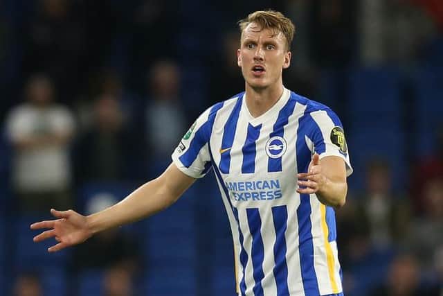 Dan Burn of Brighton & Hove Albion reacts during the Carabao Cup Third Round match between Brighton & Hove Albion and Swansea City at American Express Community Stadium on September 22, 2021 in Brighton, England. (Photo by Steve Bardens/Getty Images)