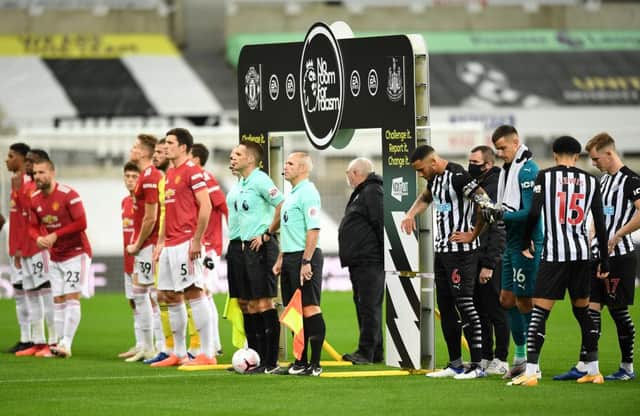 Players of Newcastle United and Manchester United line up prior to the Premier League match at St James's Park.