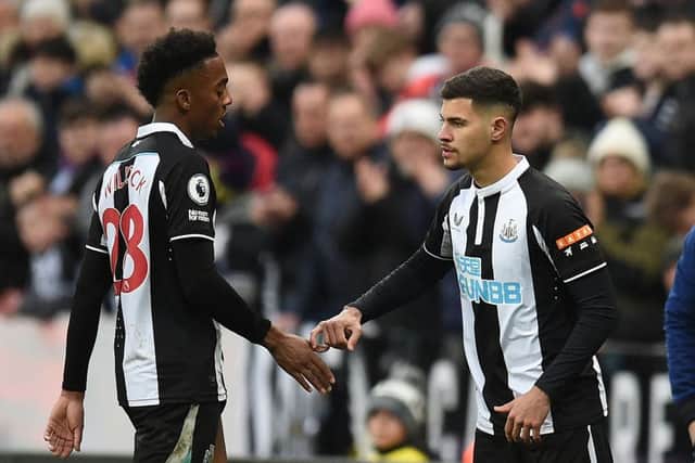 Newcastle United's Brazilian midfielder Bruno Guimaraes (R) comes on to replace Newcastle United's English midfielder Joe Willock (L) during the English Premier League football match between Newcastle United and Aston Villa at St James' Park in Newcastle-upon-Tyne, north east England on February 13, 2022.(Photo by OLI SCARFF/AFP via Getty Images)