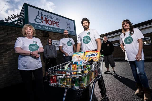 Hospitality and Hope team and service users (Left to right) Pauline Tinnelly, Chair of Trustees;  Michael Lee; Paul
Oliver, chief executive; Stephen Williamson, food bank co-ordinator;  Darren Idle; Ann-Marie Diamond, wellbeing project support worker.