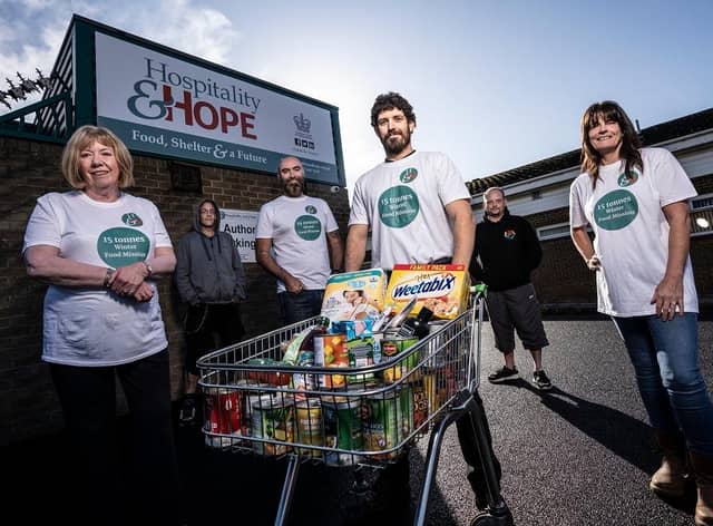 Hospitality and Hope team and service users (Left to right) Pauline Tinnelly, Chair of Trustees;  Michael Lee; Paul
Oliver, chief executive; Stephen Williamson, food bank co-ordinator;  Darren Idle; Ann-Marie Diamond, wellbeing project support worker.