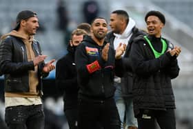 Fabian Schar, Callum Wilson and Jamal Lewis of Newcastle United applaud the fans after the Premier League match between Newcastle United and Sheffield United at St. James Park on May 19, 2021 in Newcastle upon Tyne, England.