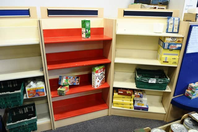 Empty shelves at the Key 2 Life food bank.