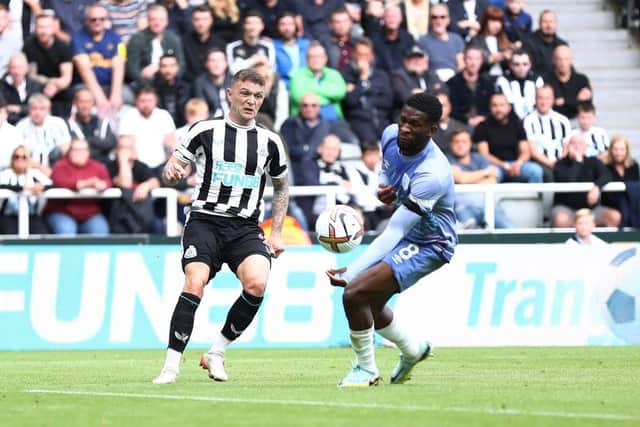 Kieran Trippier of Newcastle United crosses the ball which is adjudged to have hit the hand of Jefferson Lerma of AFC Bournemouth after a VAR check leading to a penalty being awarded during the Premier League match between Newcastle United and AFC Bournemouth at St. James Park on September 17, 2022 in Newcastle upon Tyne, England. (Photo by George Wood/Getty Images)