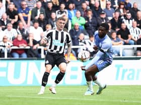 Kieran Trippier of Newcastle United crosses the ball which is adjudged to have hit the hand of Jefferson Lerma of AFC Bournemouth after a VAR check leading to a penalty being awarded during the Premier League match between Newcastle United and AFC Bournemouth at St. James Park on September 17, 2022 in Newcastle upon Tyne, England. (Photo by George Wood/Getty Images)