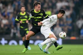 Son Heung-Min of Tottenham Hotspur is challenged by Manuel Ugarte of Sporting CP during the UEFA Champions League group D match between Tottenham Hotspur and Sporting CP at Tottenham Hotspur Stadium on October 26, 2022 in London, England. (Photo by Shaun Botterill/Getty Images)