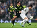 Son Heung-Min of Tottenham Hotspur is challenged by Manuel Ugarte of Sporting CP during the UEFA Champions League group D match between Tottenham Hotspur and Sporting CP at Tottenham Hotspur Stadium on October 26, 2022 in London, England. (Photo by Shaun Botterill/Getty Images)