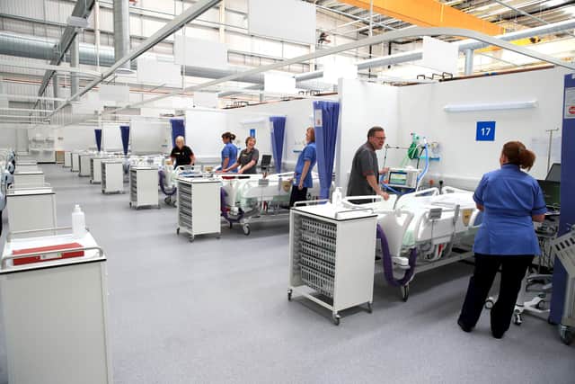Staff preparing bays at the NHS Nightingale North East hospital in Sunderland. PA Photo.