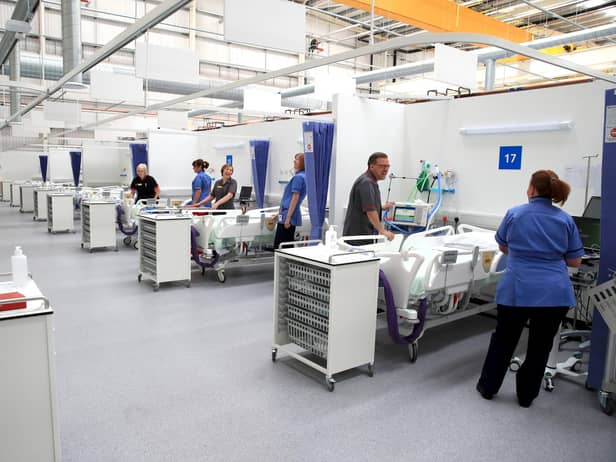 Staff preparing bays at the NHS Nightingale North East hospital in Sunderland. PA Photo.