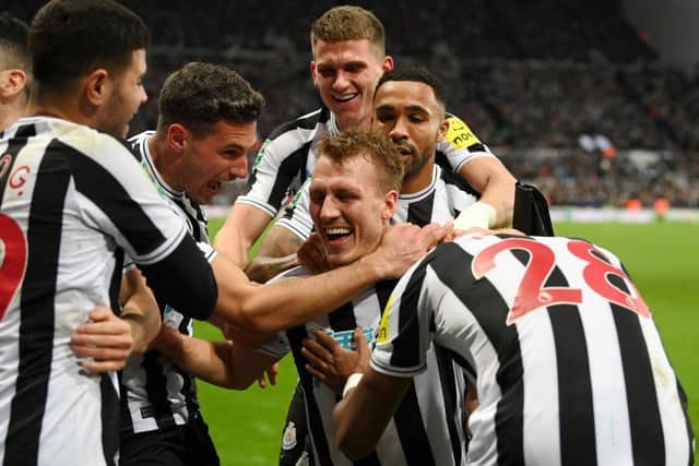 Newcastle United's Dan Burn celebrates his goal with his team-mates.