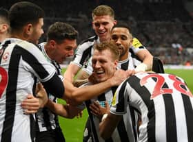 Newcastle United's Dan Burn celebrates his goal with his team-mates.