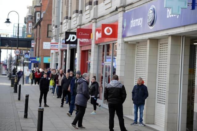 In the lockdown of 2020, queues formed outside of essential shops. Here are the people of South Shields waiting outside of Boots.
