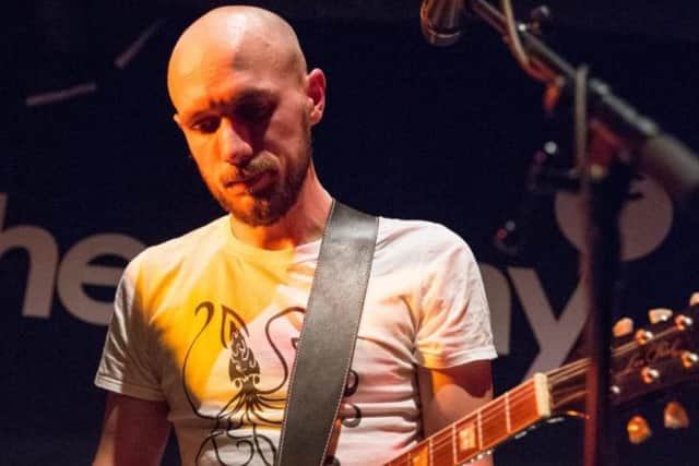 Martin Trollope playing in one of his own bands at The Cluny. Photo by David Wala.