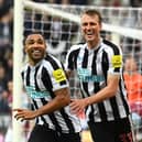 Newcastle striker Callum Wilson celebrates with Dan Burn (r) after scoring his second goal during the Premier League match between Newcastle United and Aston Villa at St. James Park on October 29, 2022 in Newcastle upon Tyne, England. (Photo by Stu Forster/Getty Images)