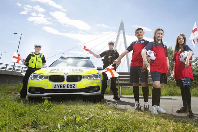 Northumbria Police Sgnt Steve Chappell and PC Greg Huntley and Northern Saints Primary School pupils Frankie, Lily, Leia and Jayden, from Sunderland.