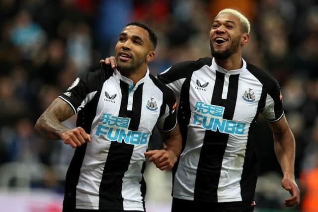 Callum Wilson of Newcastle United celebrates after scoring their side's first goal with Joelinton during the Premier League match between Newcastle United and Burnley at St. James Park on December 04, 2021 in Newcastle upon Tyne, England. (Photo by Ian MacNicol/Getty Images)