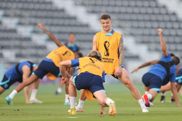 Kieran Tripper stretches during the England training session. (Photo by Alex Pantling/Getty Images).