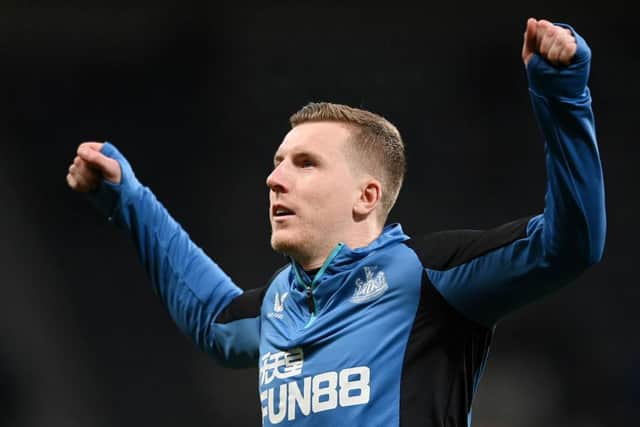 Matt Targett of Newcastle United warms up prior to the Premier League match between Newcastle United and Everton at St. James Park on February 08, 2022 in Newcastle upon Tyne, England. (Photo by Stu Forster/Getty Images)