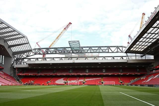 The redeveloped Anfield Road stand is seen under construction.