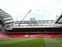 The redeveloped Anfield Road stand is seen under construction.