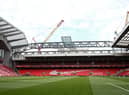 The redeveloped Anfield Road stand is seen under construction.