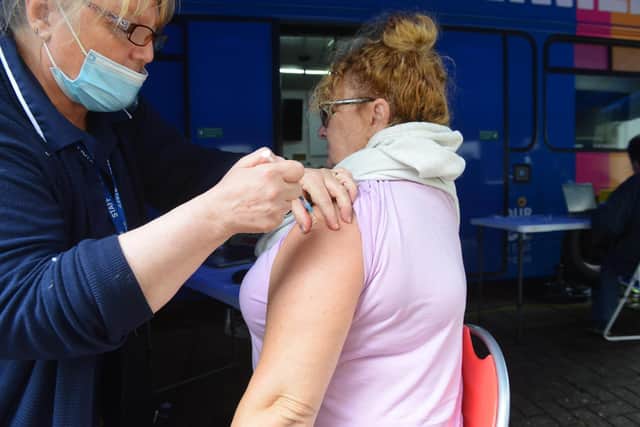 A covid booster vaccination being given at the covid jab bus in King Street, South Shields.
