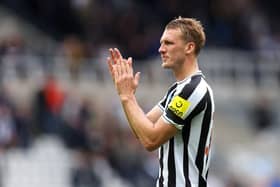 Dan Burn of Newcastle United applauds the fans following the Premier League match between Newcastle United and AFC Bournemouth at St. James Park on September 17, 2022 in Newcastle upon Tyne, England. (Photo by George Wood/Getty Images)