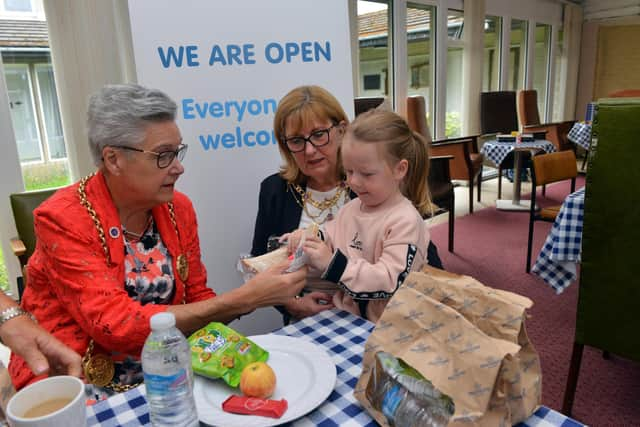 Mayor Cllr Pat Hay, left and mayoress Mrs Jean Copp with Mckenzie Shepherd-Hudson, three, at Saint Peter's Church Centre.