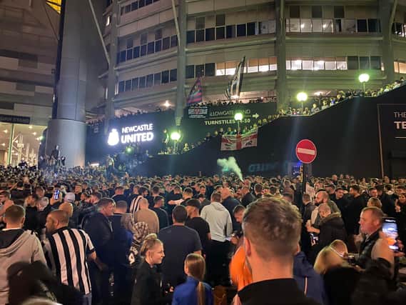 Thousands of Newcastle United fans gather outside St James's Park.