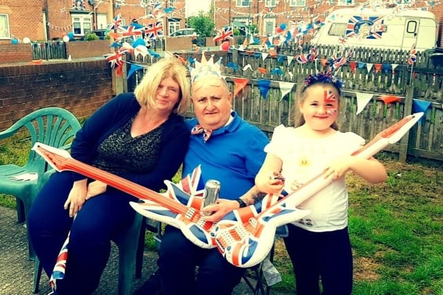 Sonia, Jimmy and Ayla bringing some music to the proceedings with their Union Flag guitars.